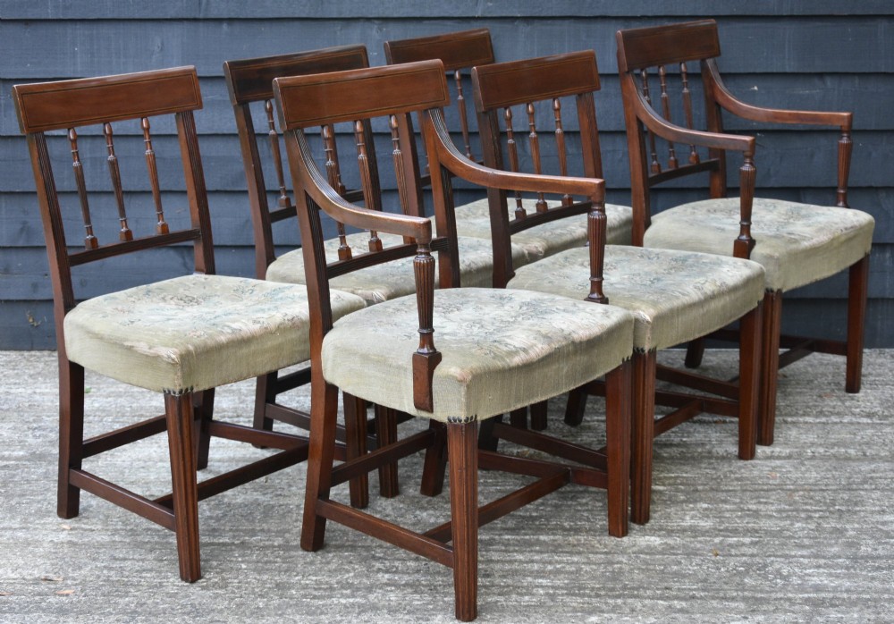 Set of six mahogany Georgian style dining chairs featuring spindle backrests, turned legs, and floral tapestry upholstery. View II