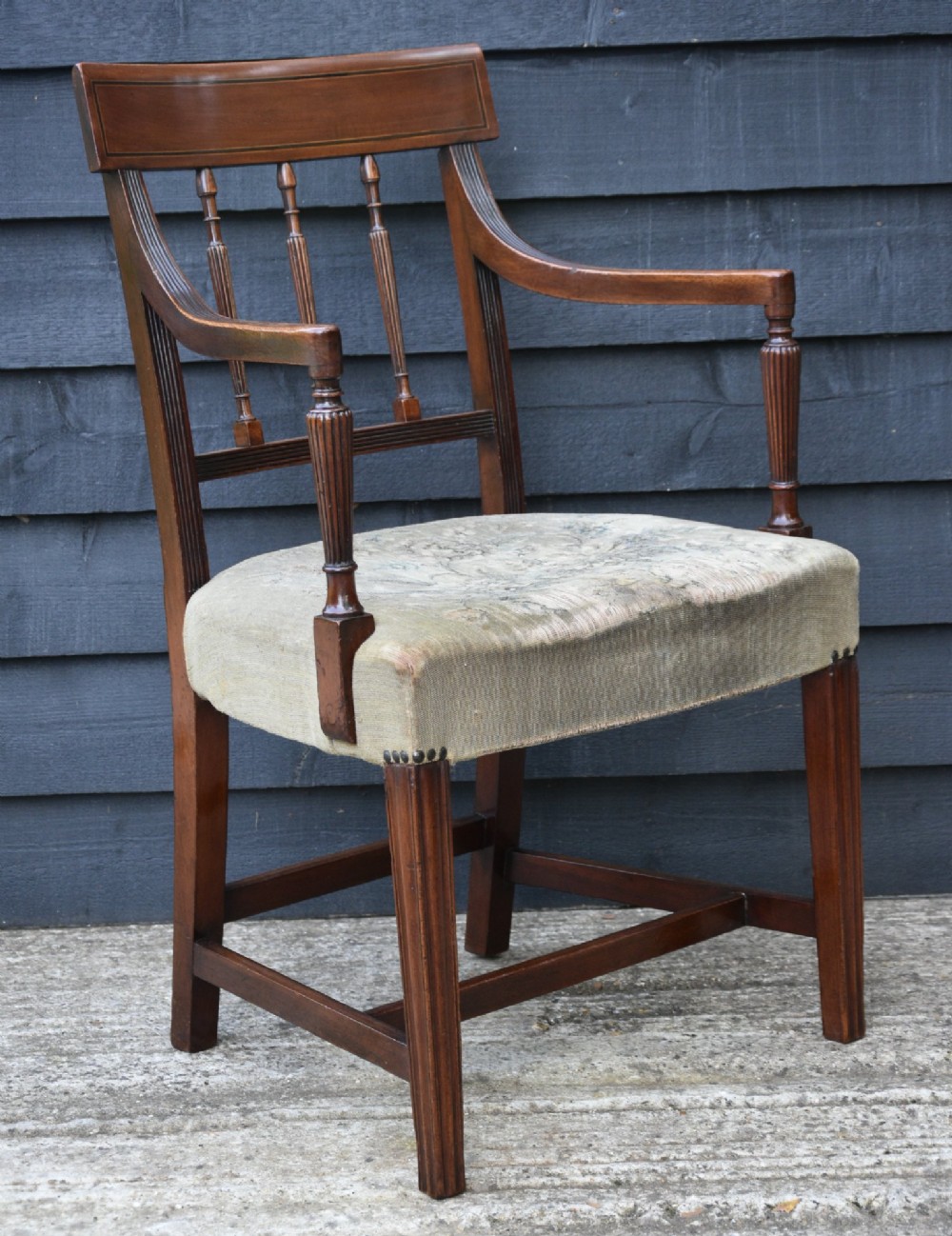 Set of six mahogany Georgian style dining chairs featuring spindle backrests, turned legs, and floral tapestry upholstery. View III
