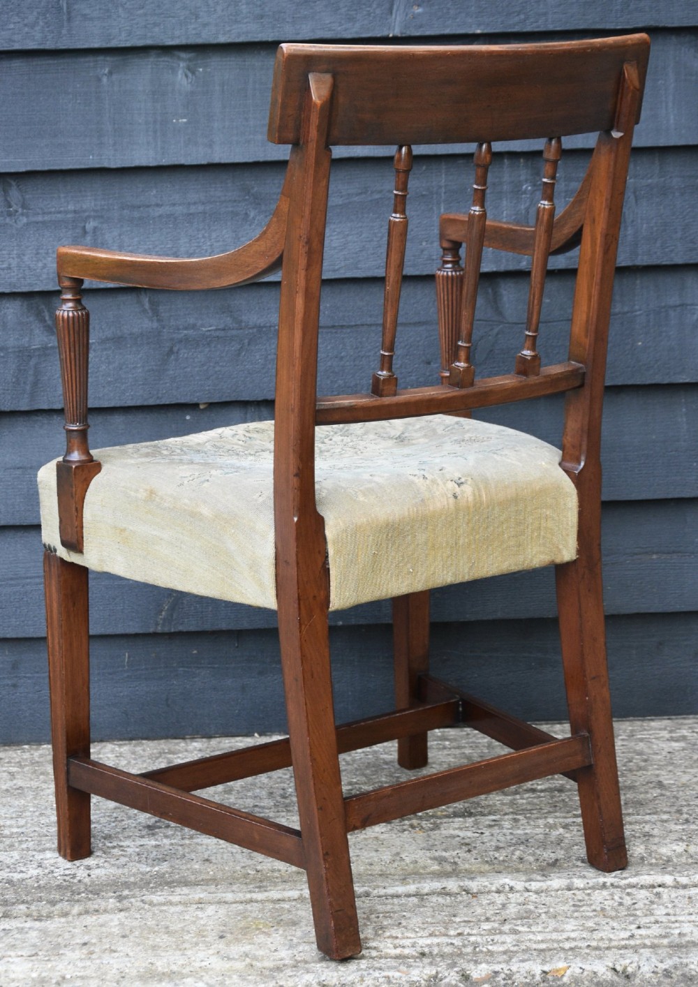 Set of six mahogany Georgian style dining chairs featuring spindle backrests, turned legs, and floral tapestry upholstery. View IV