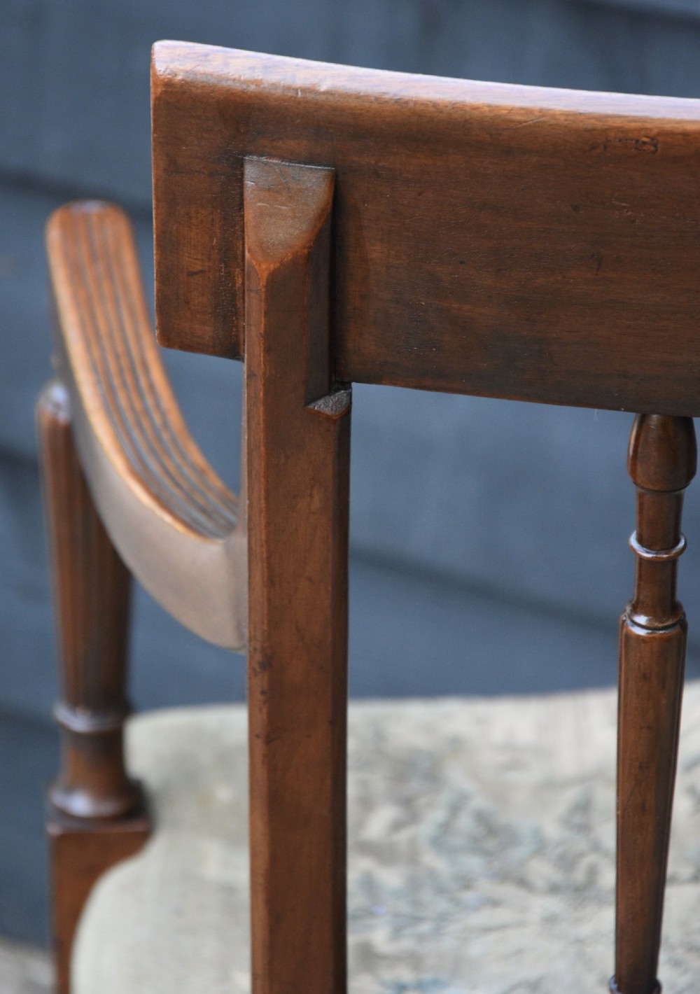 Set of six mahogany Georgian style dining chairs featuring spindle backrests, turned legs, and floral tapestry upholstery. View V