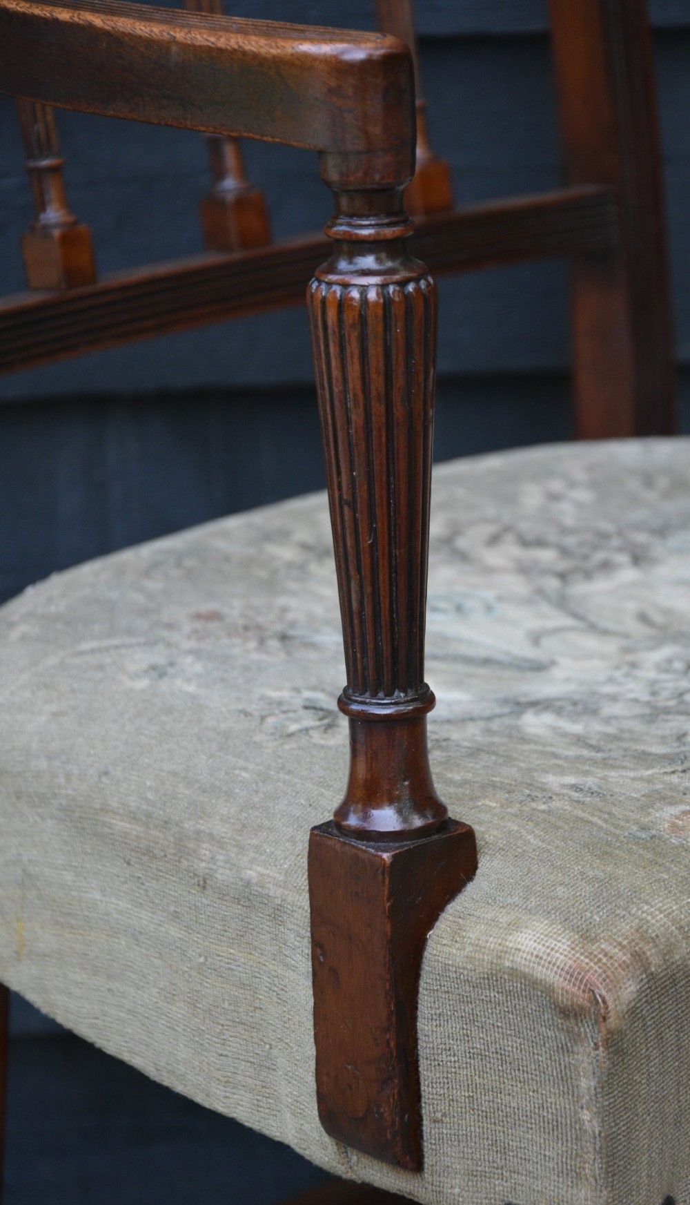 Set of six mahogany Georgian style dining chairs featuring spindle backrests, turned legs, and floral tapestry upholstery. View VI