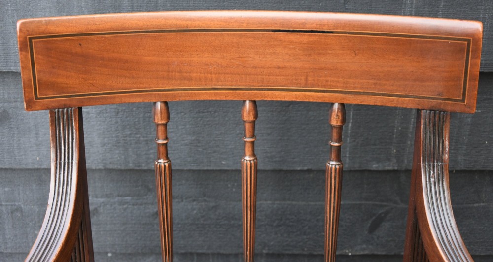 Set of six mahogany Georgian style dining chairs featuring spindle backrests, turned legs, and floral tapestry upholstery. View VII