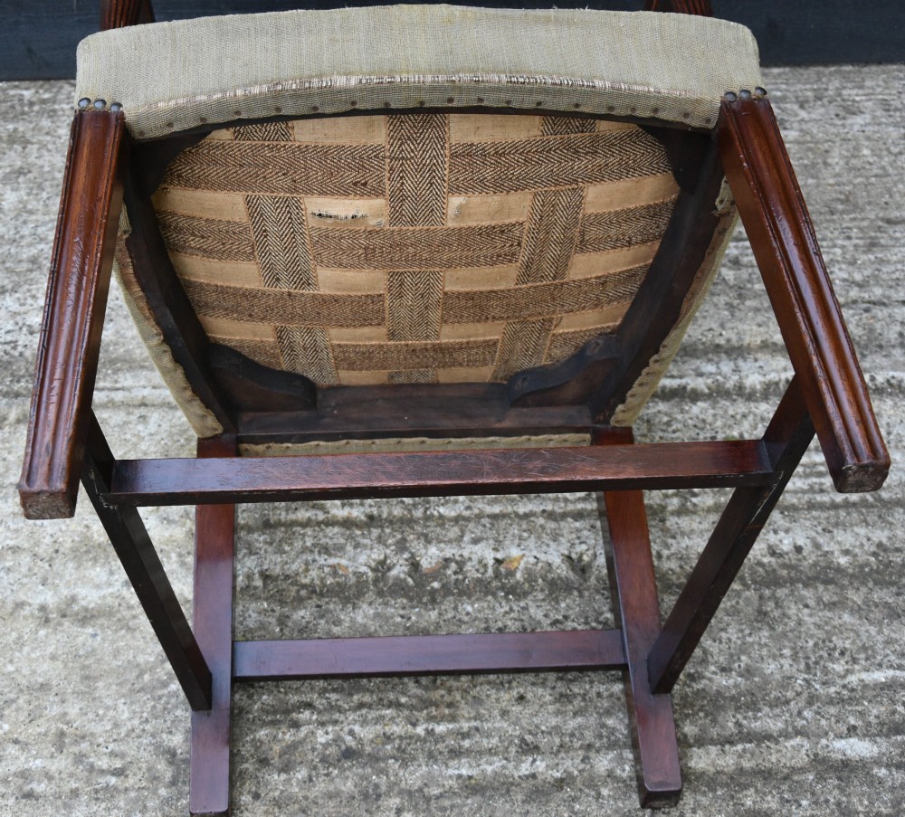 Set of six mahogany Georgian style dining chairs featuring spindle backrests, turned legs, and floral tapestry upholstery. View X