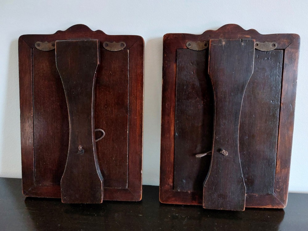 A pair of rectangular Edwardian photo frames featuring pierced scrollwork silver fronts mounted onto dark hardwood backings. View III