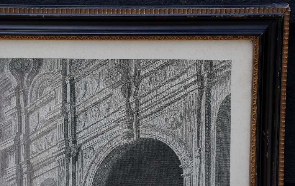 A large 19th-century monochrome engraving depicting a crowded historic courtyard scene inside a black Hogarth frame. View V