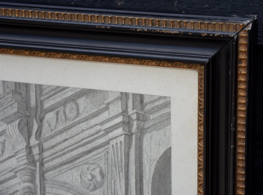 A large 19th-century monochrome engraving depicting a crowded historic courtyard scene inside a black Hogarth frame. View VI