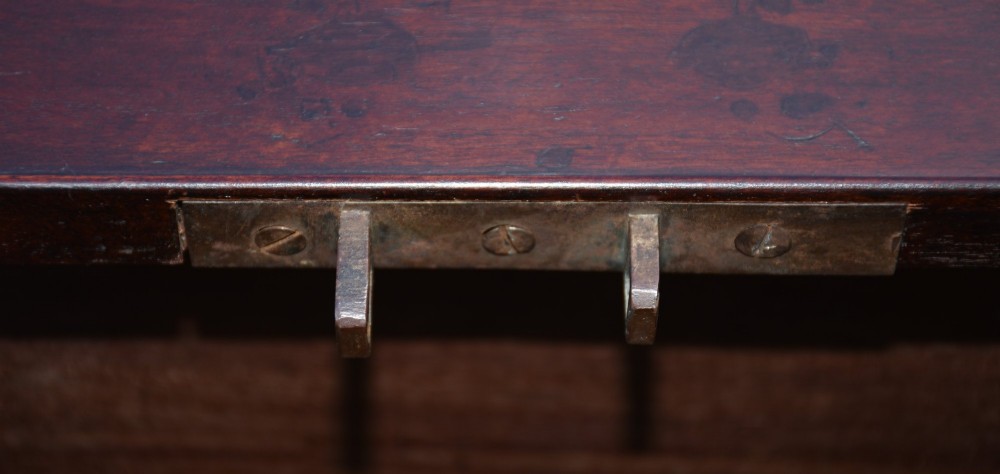 A Georgian mahogany travelling chest featuring side brass carrying handles, an escutcheon lock, and raised bracket feet. View IX