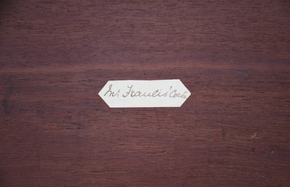 A Georgian mahogany travelling chest featuring side brass carrying handles, an escutcheon lock, and raised bracket feet. View XIV