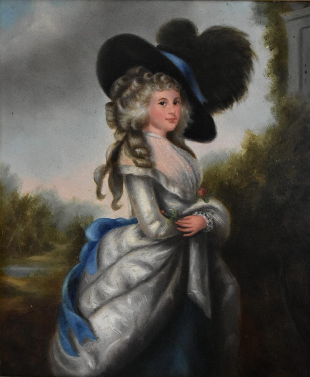 An Edwardian oil painting on board depicting a young lady in an 18th-century style dress and feathered hat, presented in an ornate gilt frame. View II
