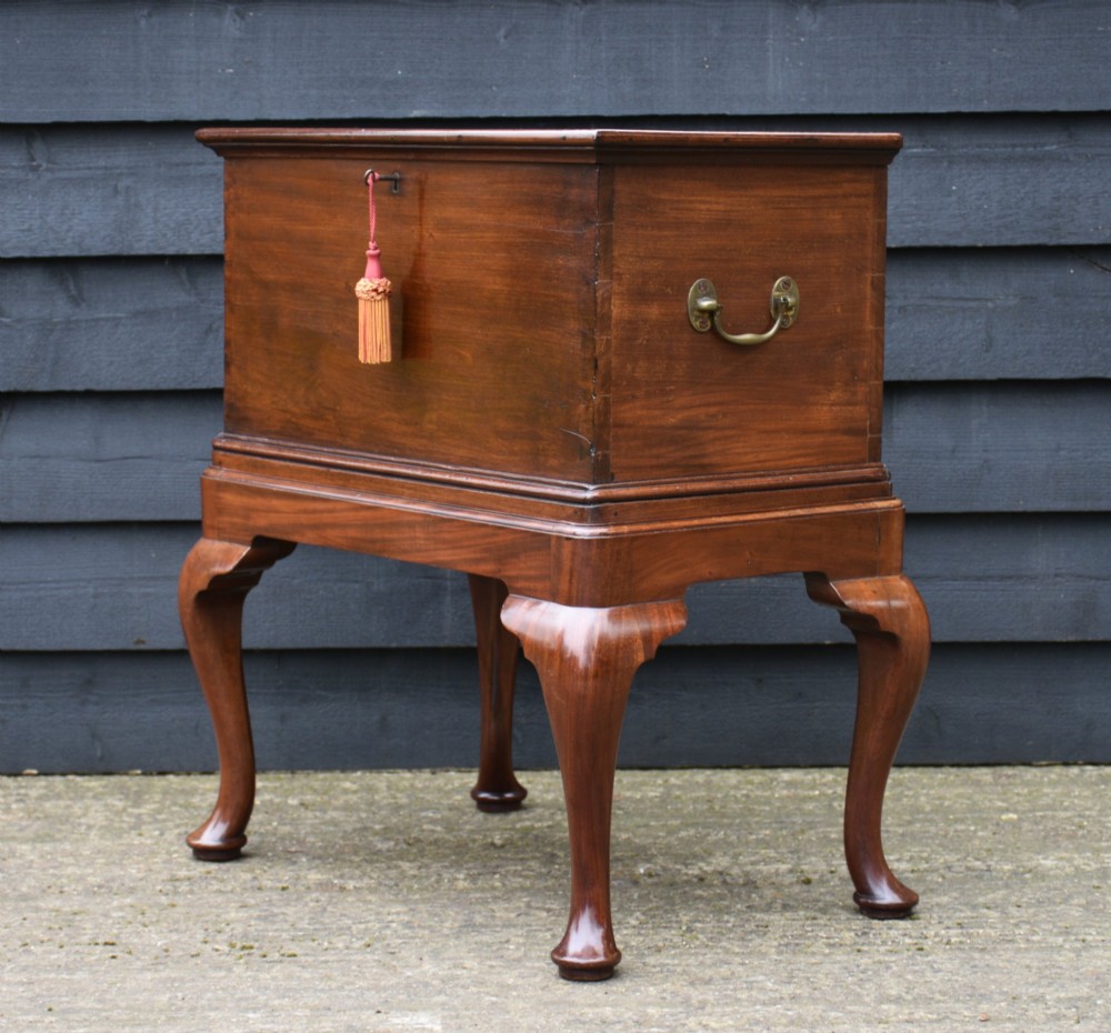 A 19th-century mahogany box on stand featuring cabriole legs, pad feet, brass side carrying handles, and a key with a pink tassel. View II