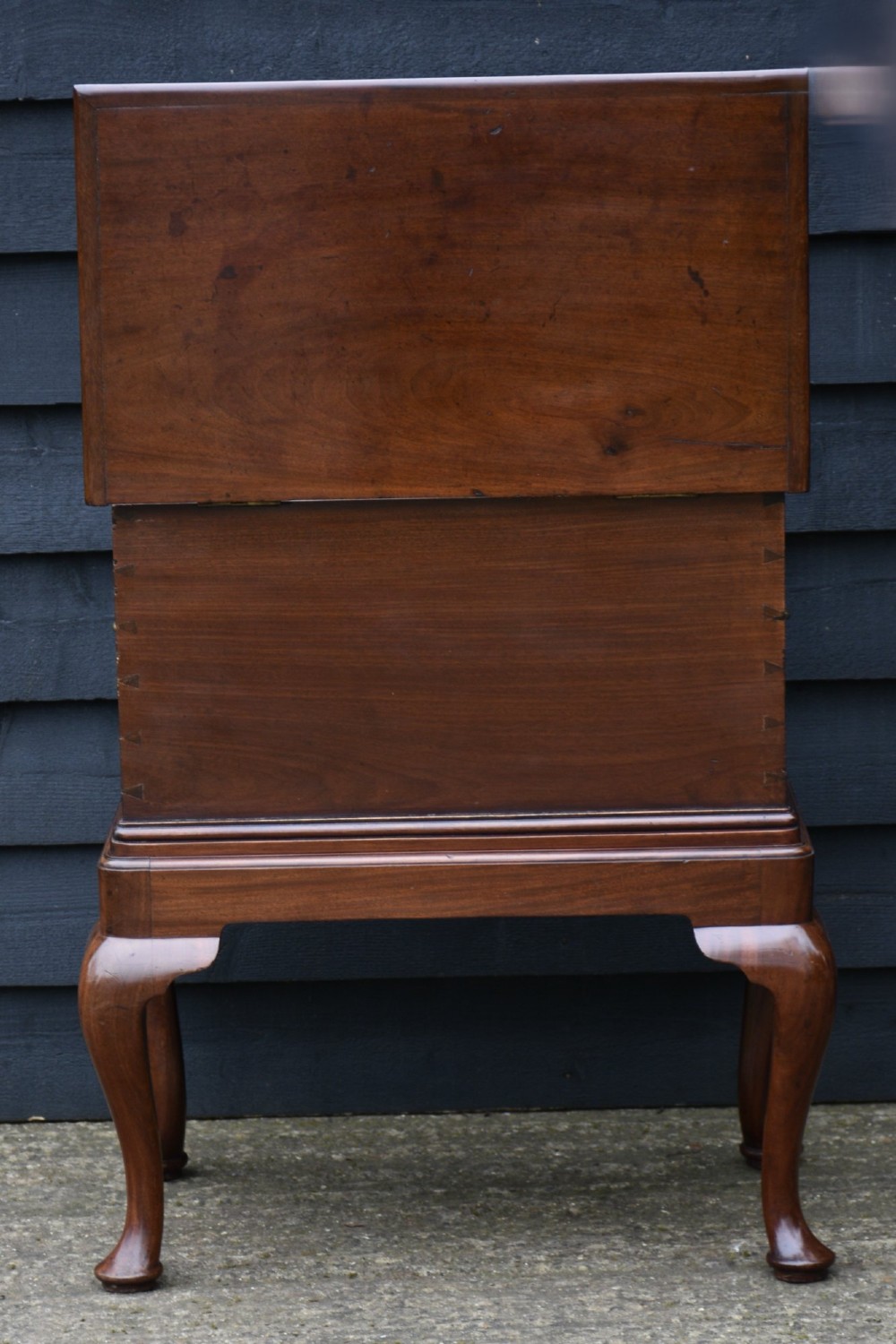 A 19th-century mahogany box on stand featuring cabriole legs, pad feet, brass side carrying handles, and a key with a pink tassel. View IV