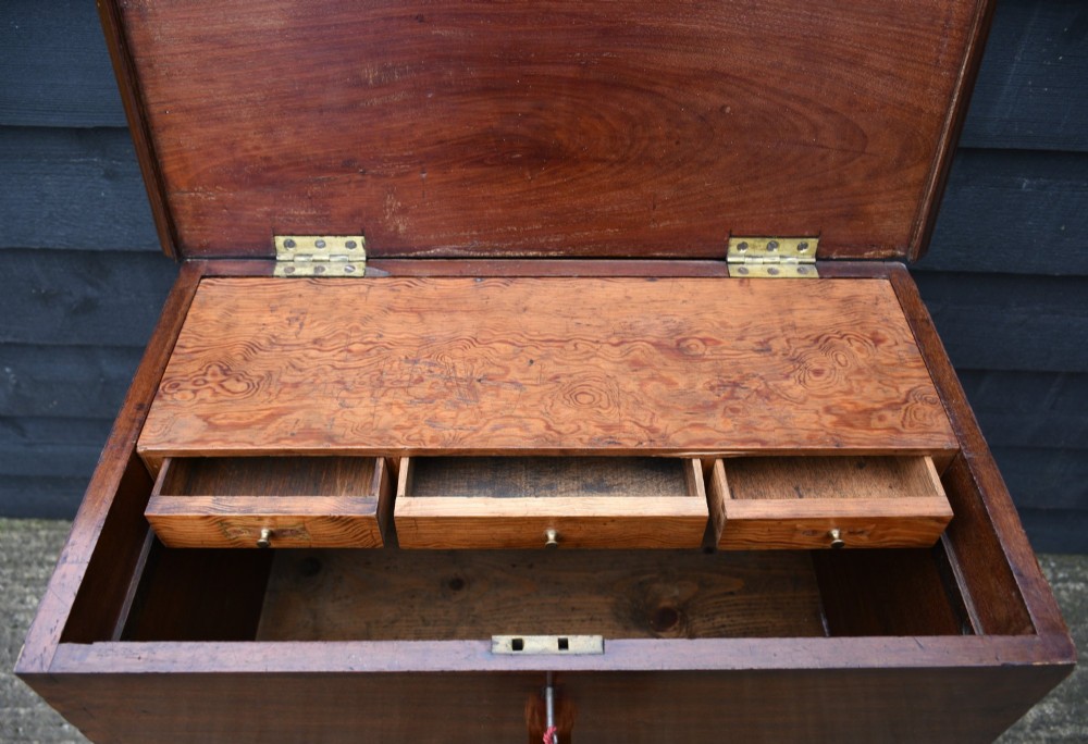 A 19th-century mahogany box on stand featuring cabriole legs, pad feet, brass side carrying handles, and a key with a pink tassel. View VI