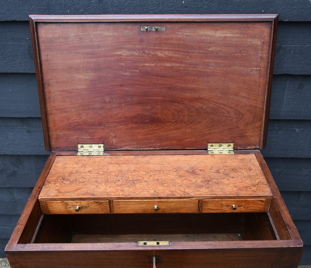 A 19th-century mahogany box on stand featuring cabriole legs, pad feet, brass side carrying handles, and a key with a pink tassel. View VII