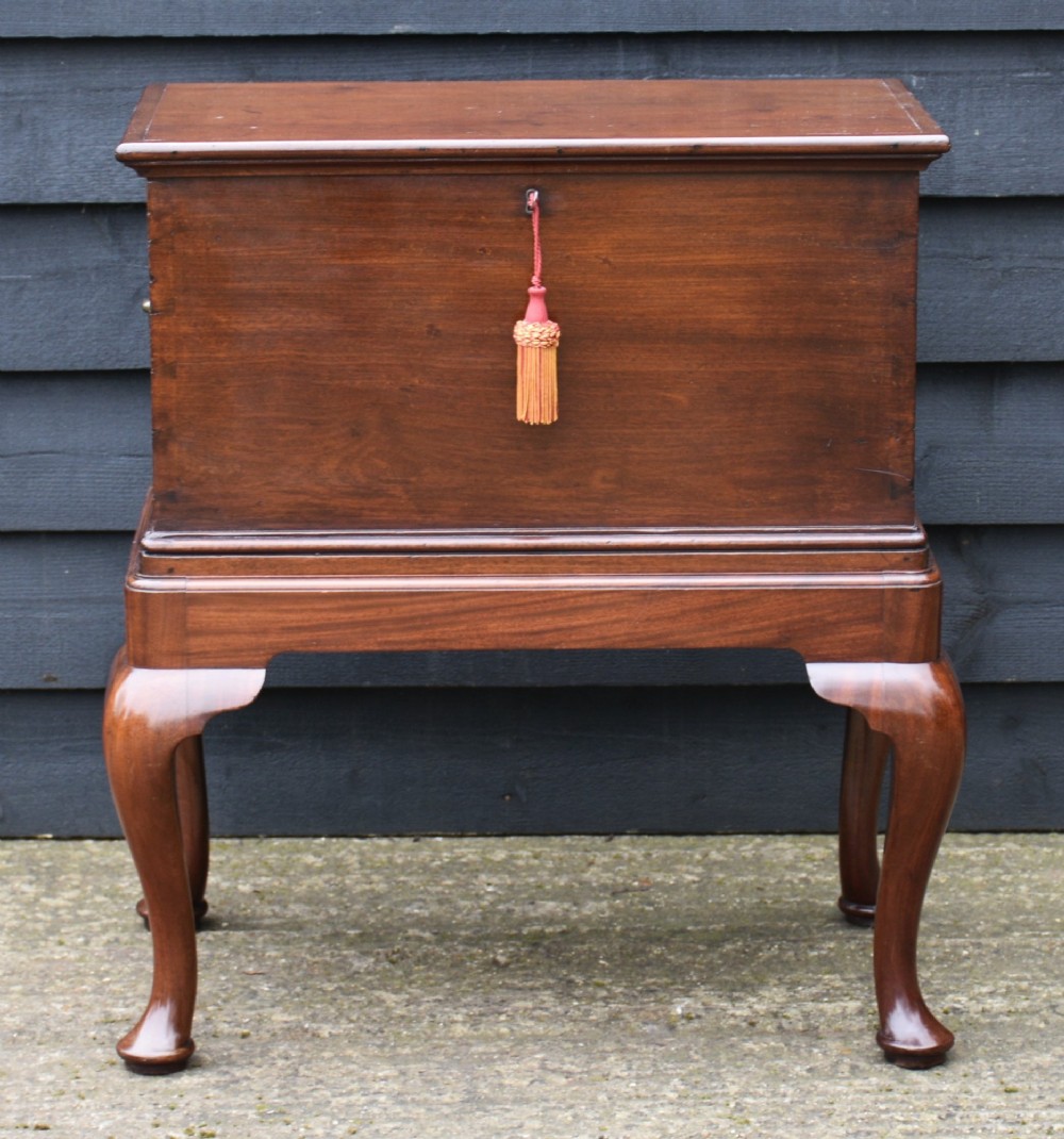 A 19th-century mahogany box on stand featuring cabriole legs, pad feet, brass side carrying handles, and a key with a pink tassel. View IX