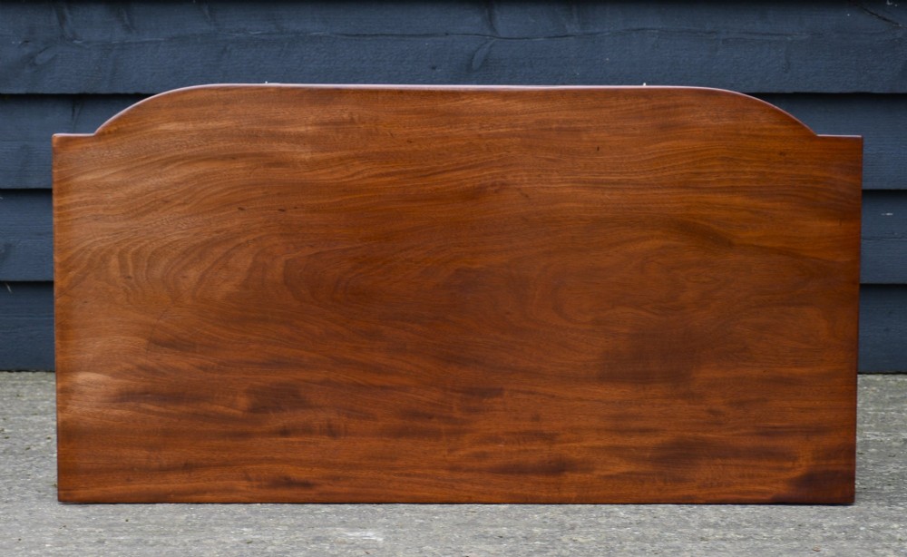 A Regency mahogany bow-fronted side table featuring a single drawer with brass ring handles and four turned tapered legs. View VII