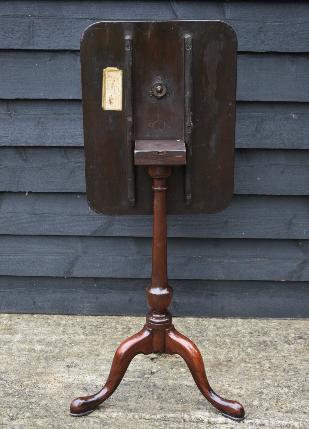 A 19th-century fruitwood wine table featuring a rectangular tilt top on a turned pedestal column with tripod cabriole legs. View II