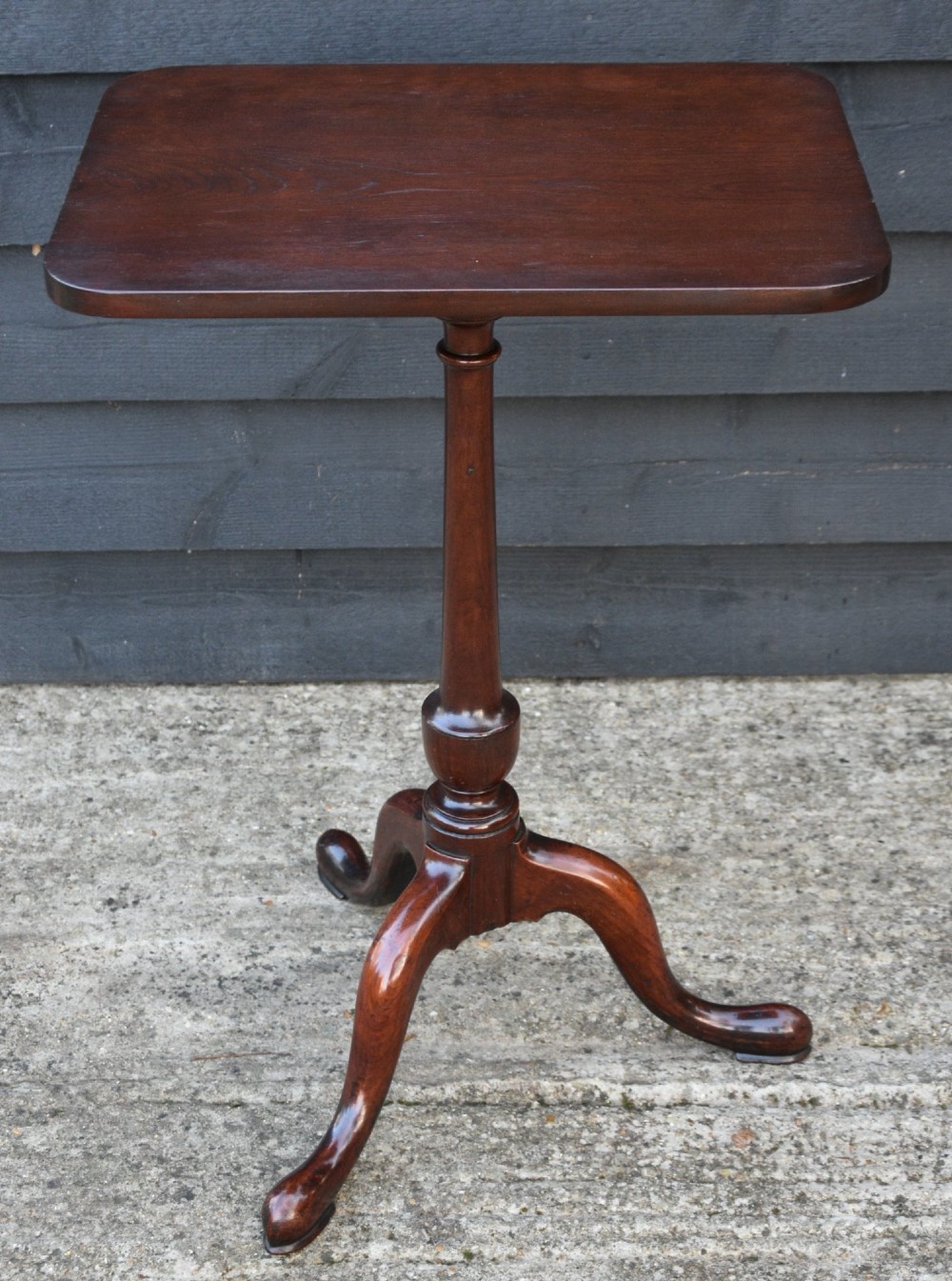 A 19th-century fruitwood wine table featuring a rectangular tilt top on a turned pedestal column with tripod cabriole legs. View VII
