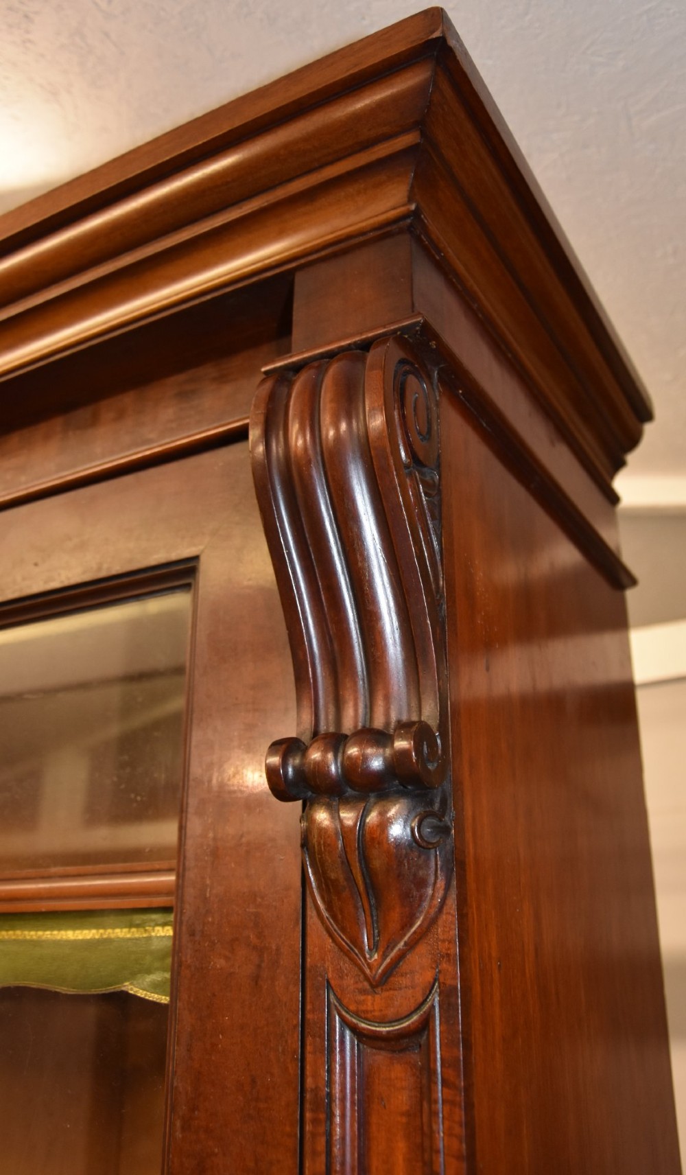 A large 19th-century William IV mahogany library bookcase cabinet featuring glazed upper doors above panelled lower cupboard doors. View VI