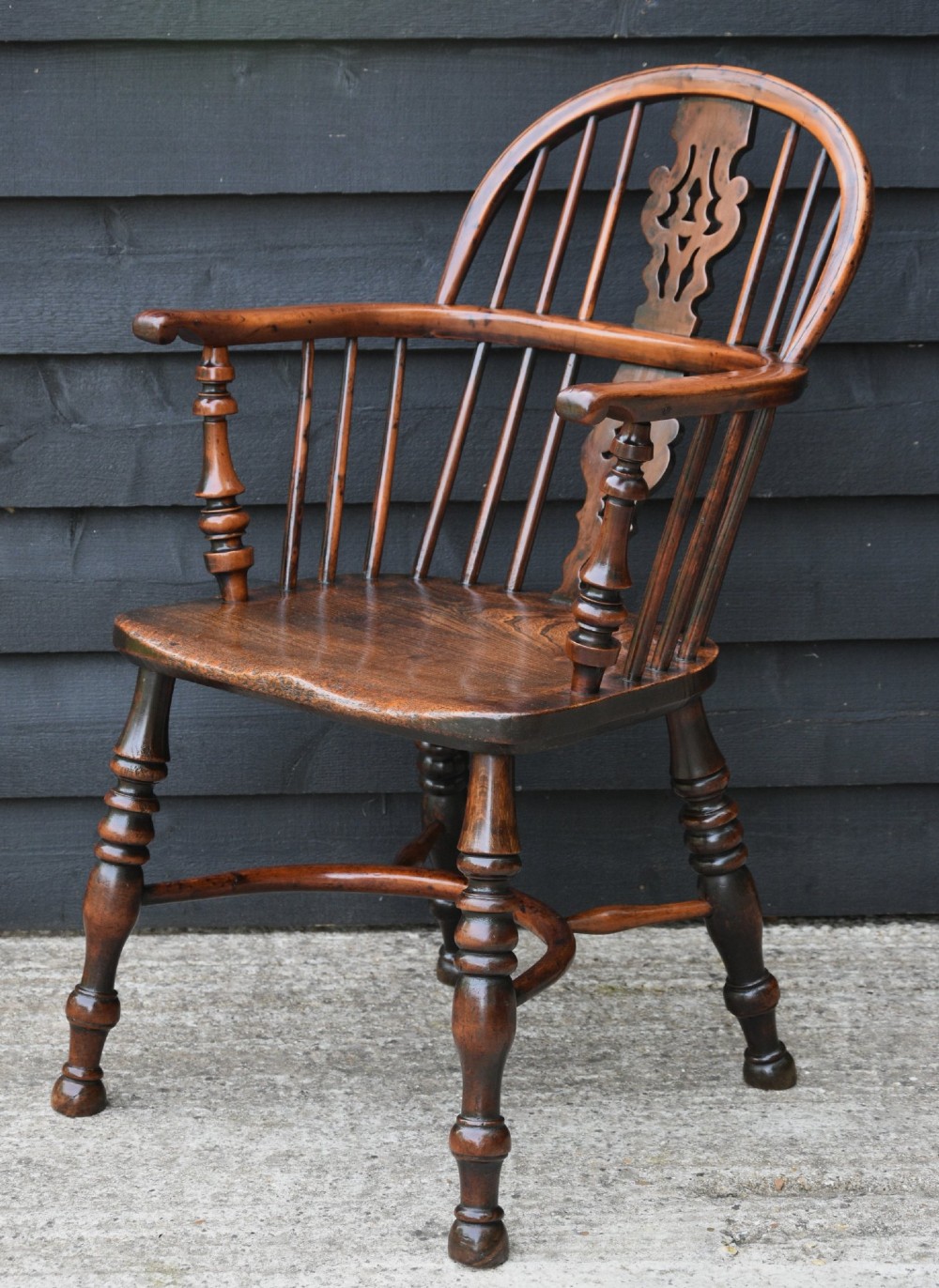 A matched pair of 18th-century Georgian Windsor armchairs crafted from warm brown yew and elm with hooped backs and turned legs. View III