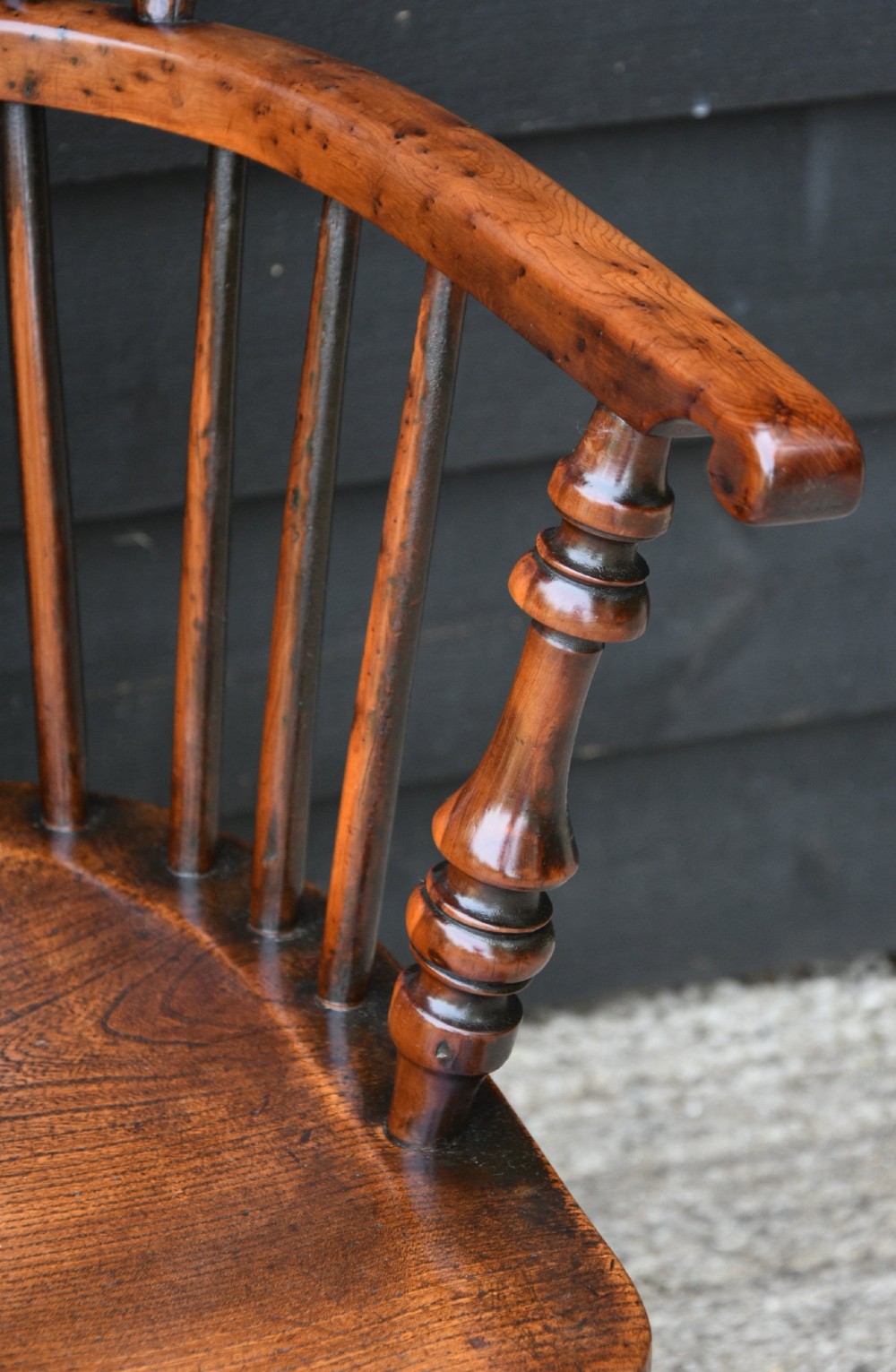 A matched pair of 18th-century Georgian Windsor armchairs crafted from warm brown yew and elm with hooped backs and turned legs. View XII
