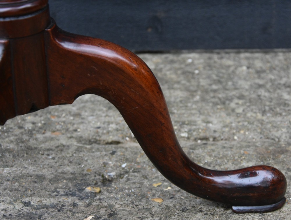 A 19th-century fruitwood tilt-top wine table featuring a rounded rectangular surface set upon a turned pedestal column with three cabriole legs. View III