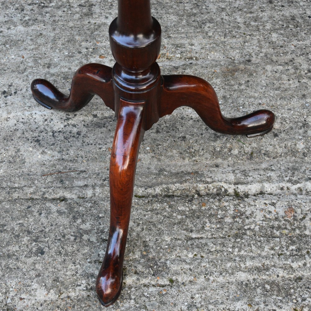 A 19th-century fruitwood tilt-top wine table featuring a rounded rectangular surface set upon a turned pedestal column with three cabriole legs. View VI