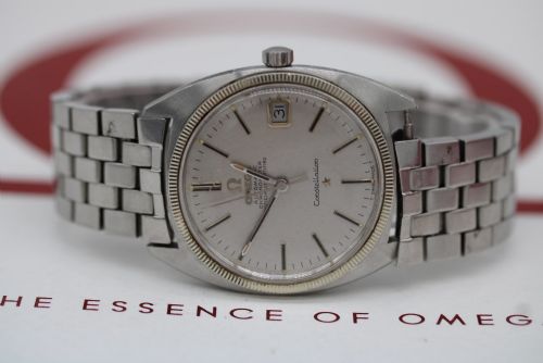 fig 2. A 1969 vintage Omega Constellation wristwatch featuring a stainless steel case, fluted bezel, silver linen dial, date window, and steel link bracelet.