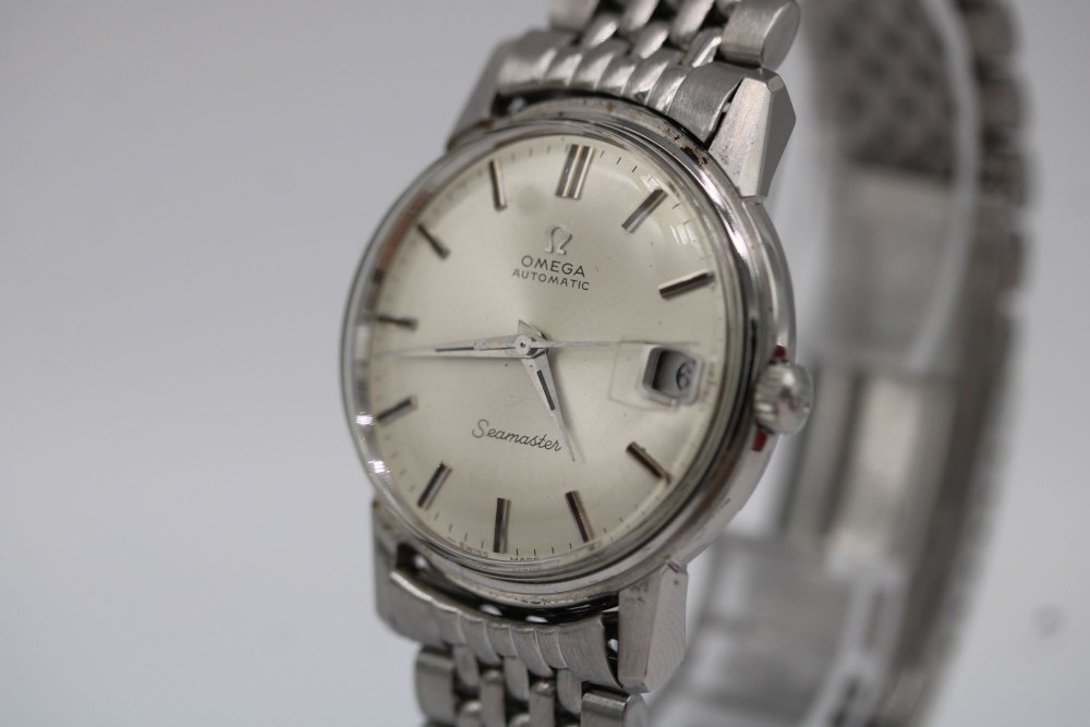 A vintage stainless steel Omega Seamaster automatic wristwatch with a silver dial and a beads-of-rice metal bracelet. View II