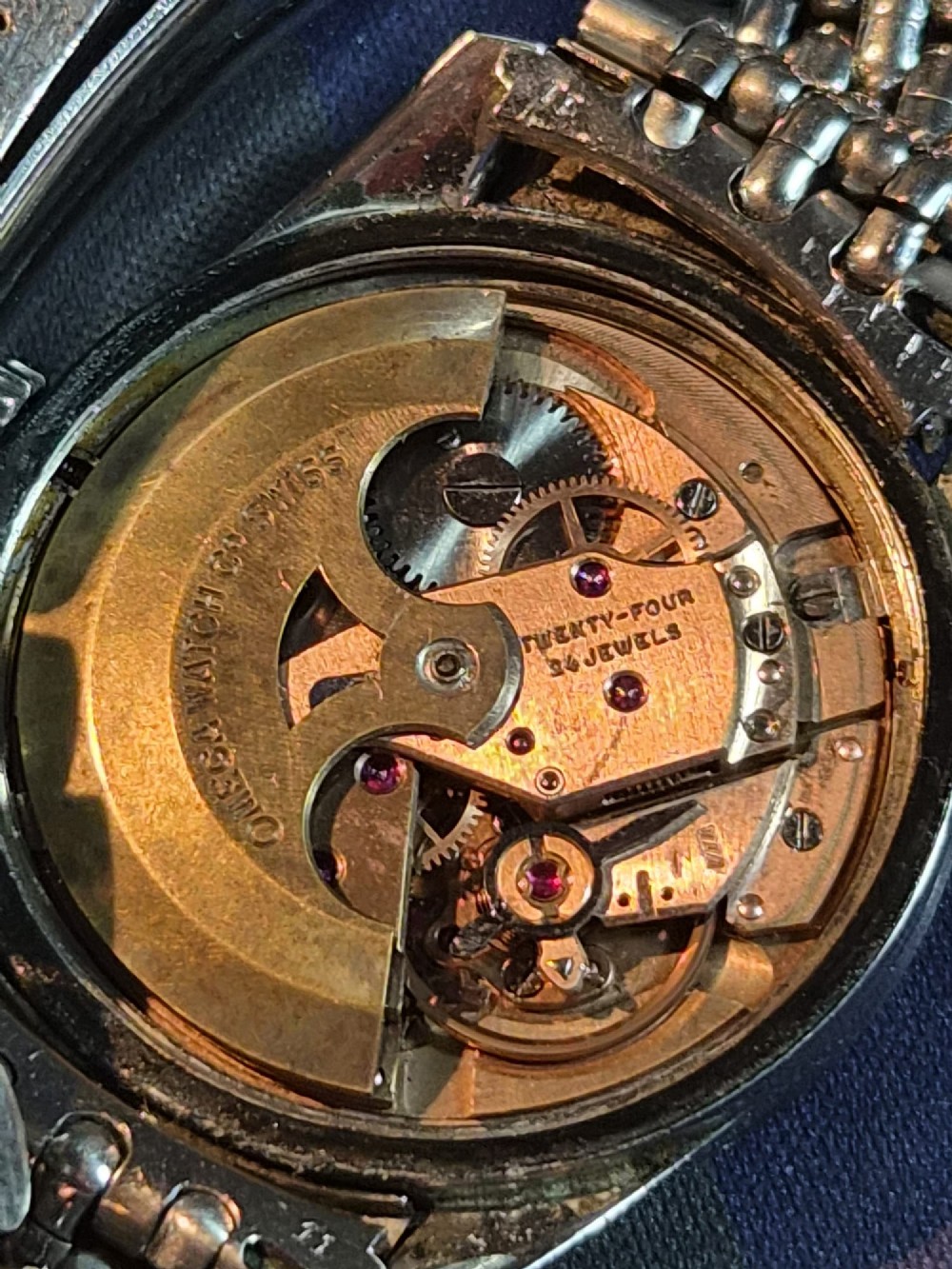 A 1960s stainless steel Omega Seamaster wristwatch with a patinated cream dial and a beads-of-rice bracelet. View VII