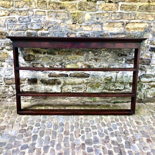 AN EARLY GEORGE III OAK PLATE RACK