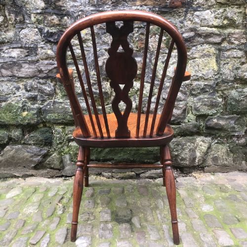 AN EARLY 19TH CENTURY YEW AND ELM DRAUGHT BACK WINDSOR CHAIR - ADDITIONAL PHOTO 6