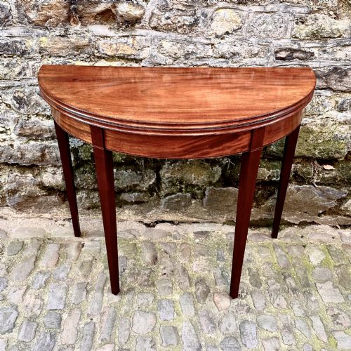 A GEORGE III MAHOGANY DEMILUNE TEA TABLE - ADDITIONAL PHOTO 1