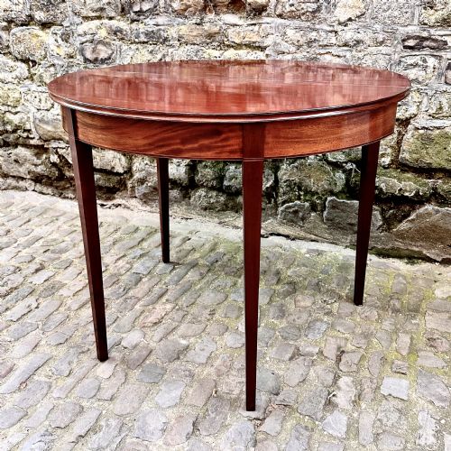 A GEORGE III MAHOGANY DEMILUNE TEA TABLE - ADDITIONAL PHOTO 7