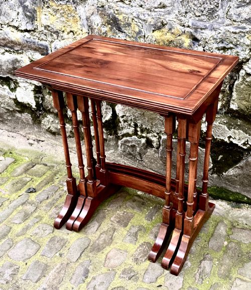 AN EDWARDIAN NEST OF THREE YEW WOOD TABLES - ADDITIONAL PHOTO 1
