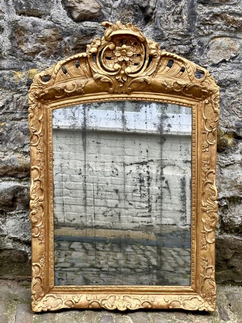 an 18th century italian giltwood overmantel mirror - CATEGORY: ANTIQUE MIRRORS - DATED 18TH CENTURY