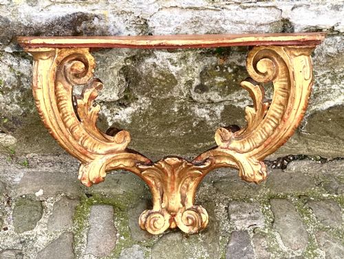 A PAIR OF 18TH CENTURY ITALIAN GILTWOOD CONSOLE TABLES - ADDITIONAL PHOTO 1
