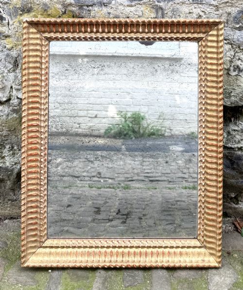 AN EARLY 19TH CENTURY FRENCH MIRROR