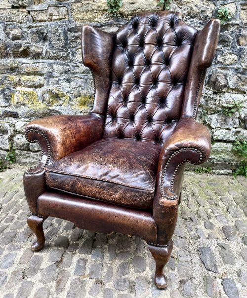 A FINE LATE VICTORIAN LEATHER WING ARMCHAIR