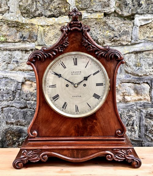 A MID VICTORIAN MAHOGANY BRACKET CLOCK