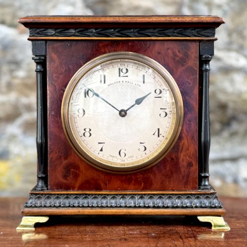 AN EARLY 20TH CENTURY MANTEL CLOCK BY WALKER AND HALL