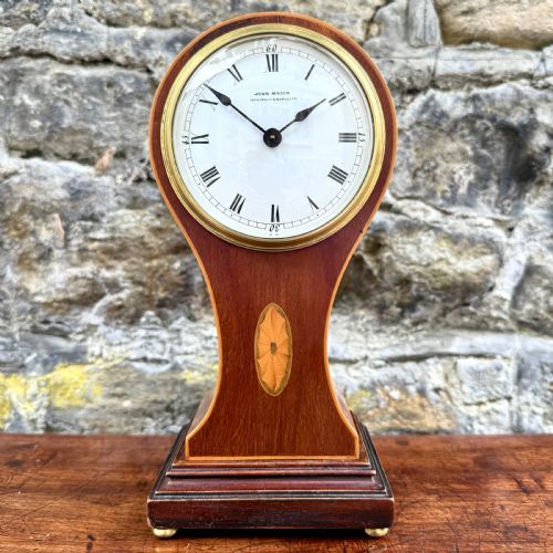 An Edwardian Mahogany 'Balloon' Mantel Clock