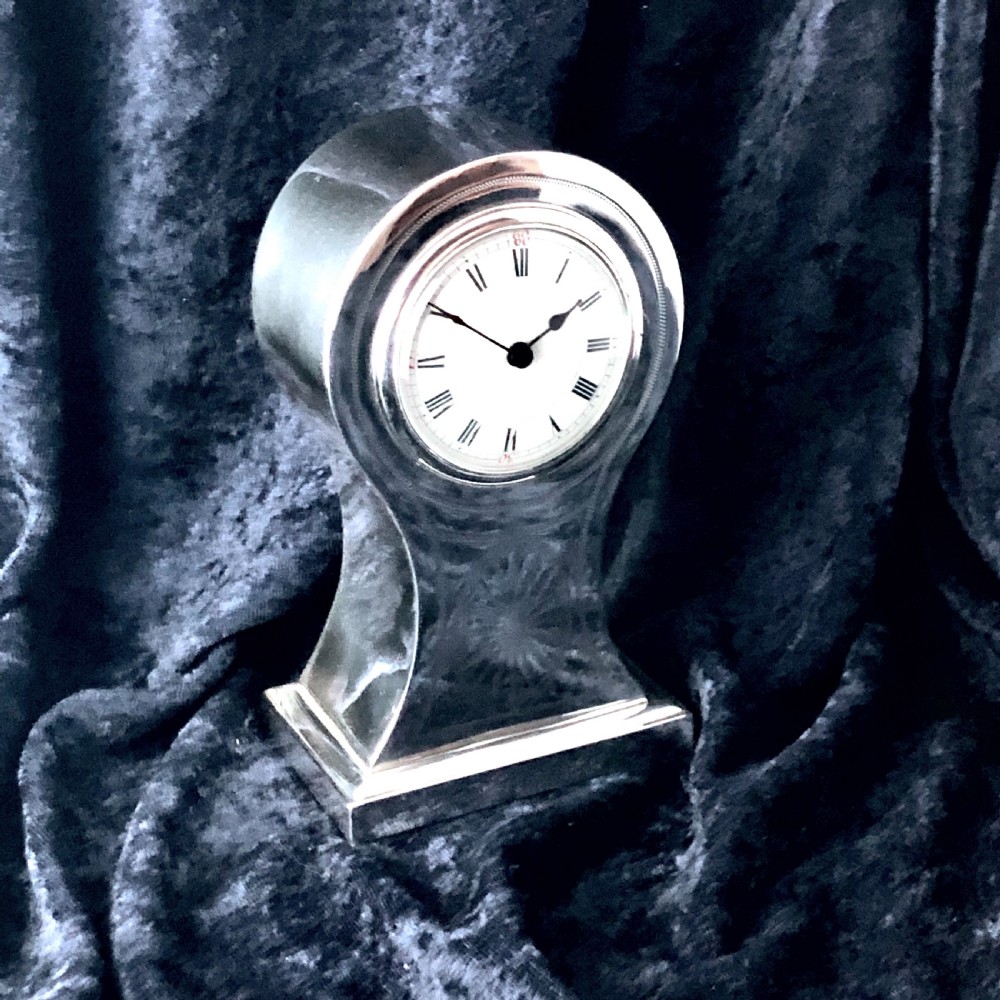 An Edwardian silver mantel clock  View III
