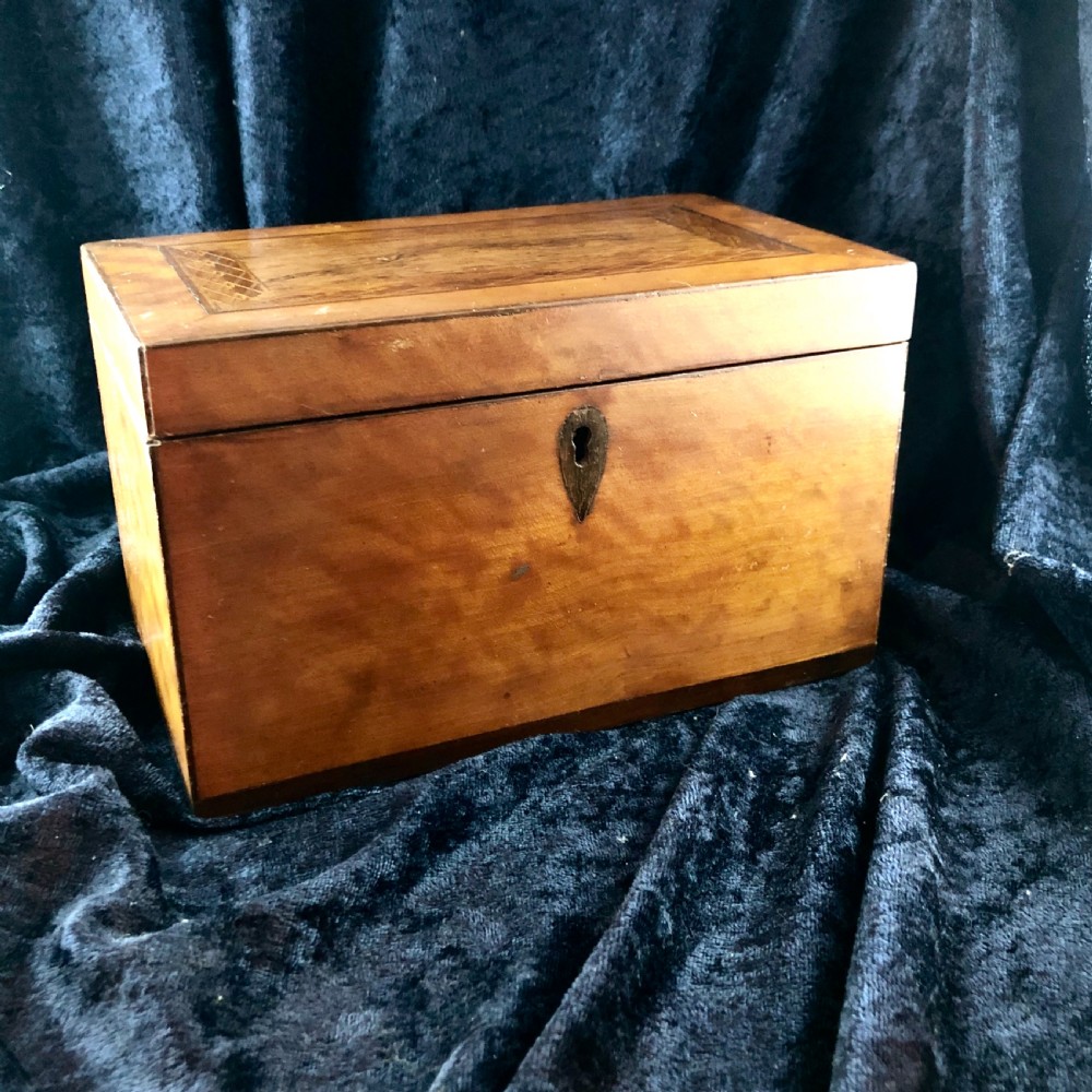 A George III satinwood tea caddy 