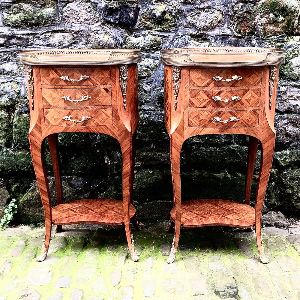 A pair of French Kingwood bedside table or lamp tables