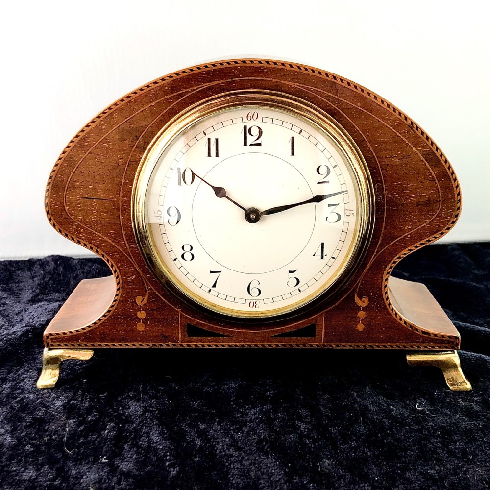 An Art Nouveau mahogany mantel clock timepiece.  View III