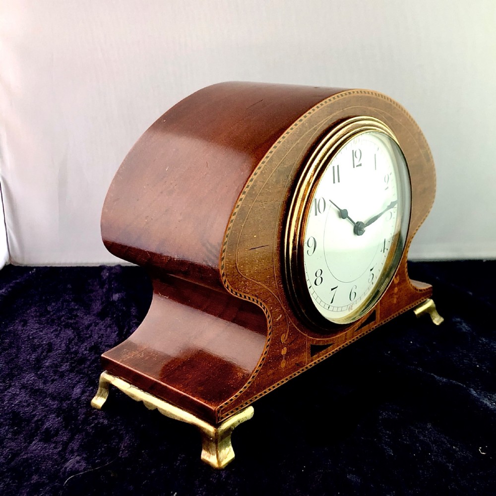 An Art Nouveau mahogany mantel clock timepiece.  View IV