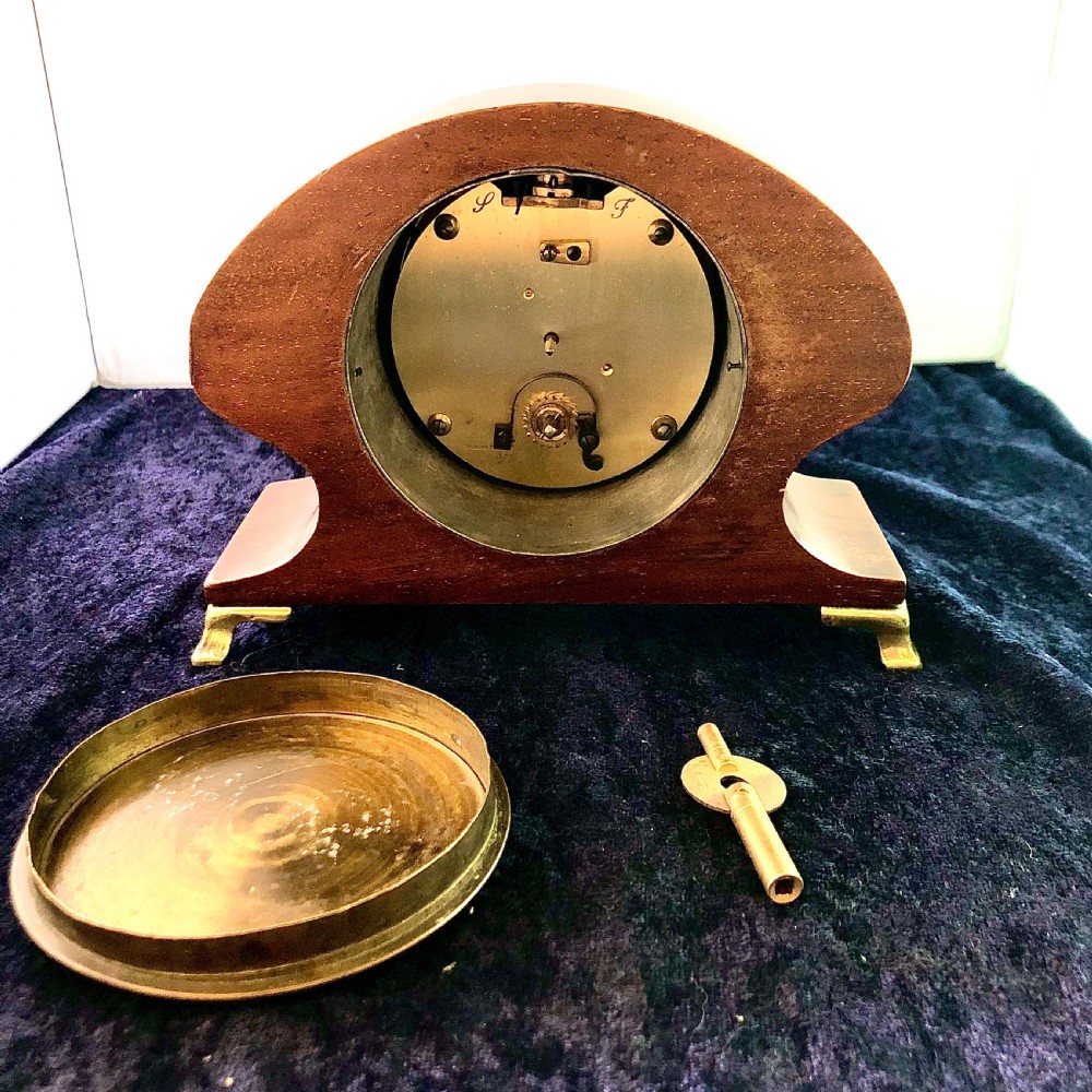 An Art Nouveau mahogany mantel clock timepiece.  View V
