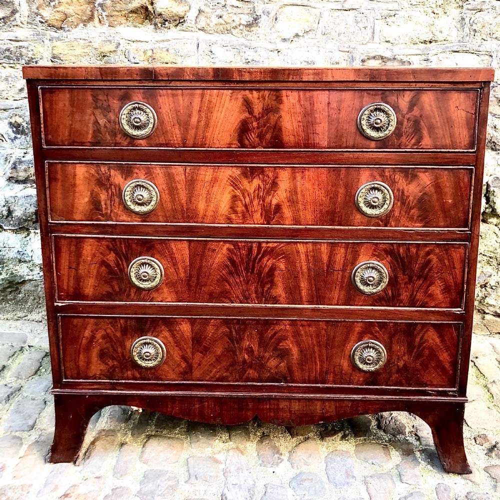 A small George III mahogany caddy top chest of drawers
