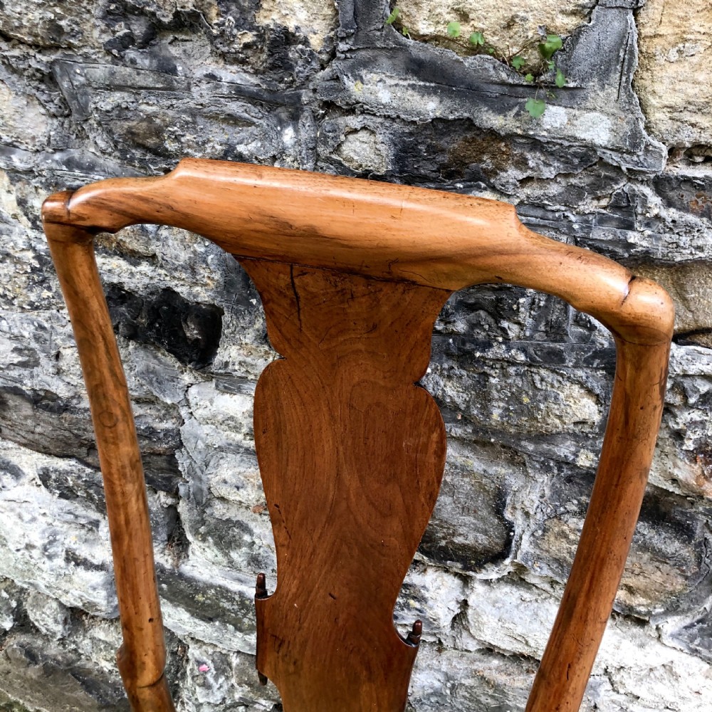 A Queen Anne walnut side chair featuring a vasiform back splat, cabriole front legs with pad feet, and a yellow patterned silk upholstered seat. View VI