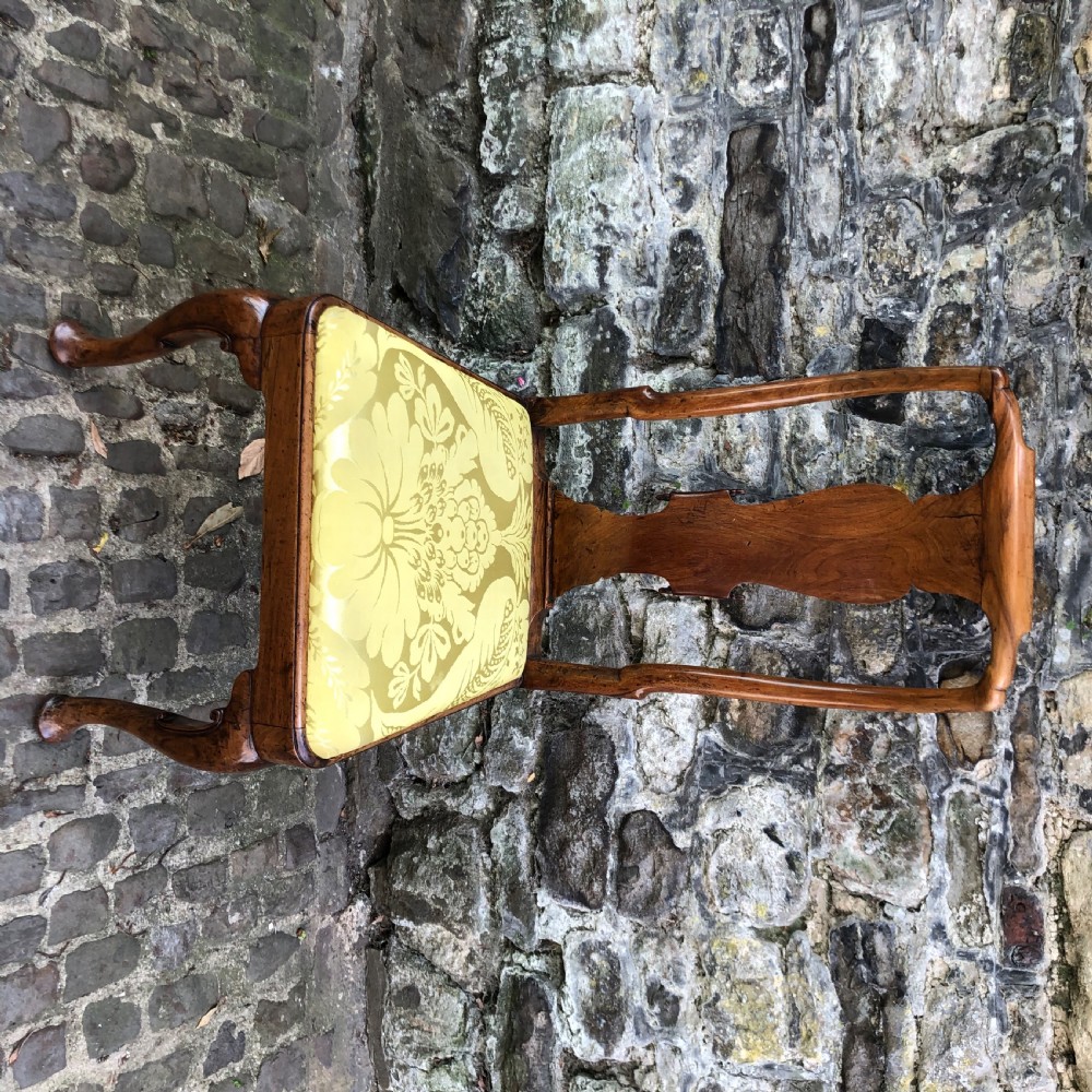 A Queen Anne walnut side chair featuring a vasiform back splat, cabriole front legs with pad feet, and a yellow patterned silk upholstered seat. View VIII